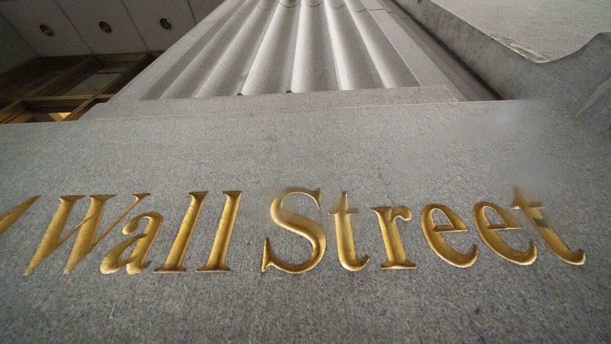 After another bumpy day, Wall Street ends mostly higher